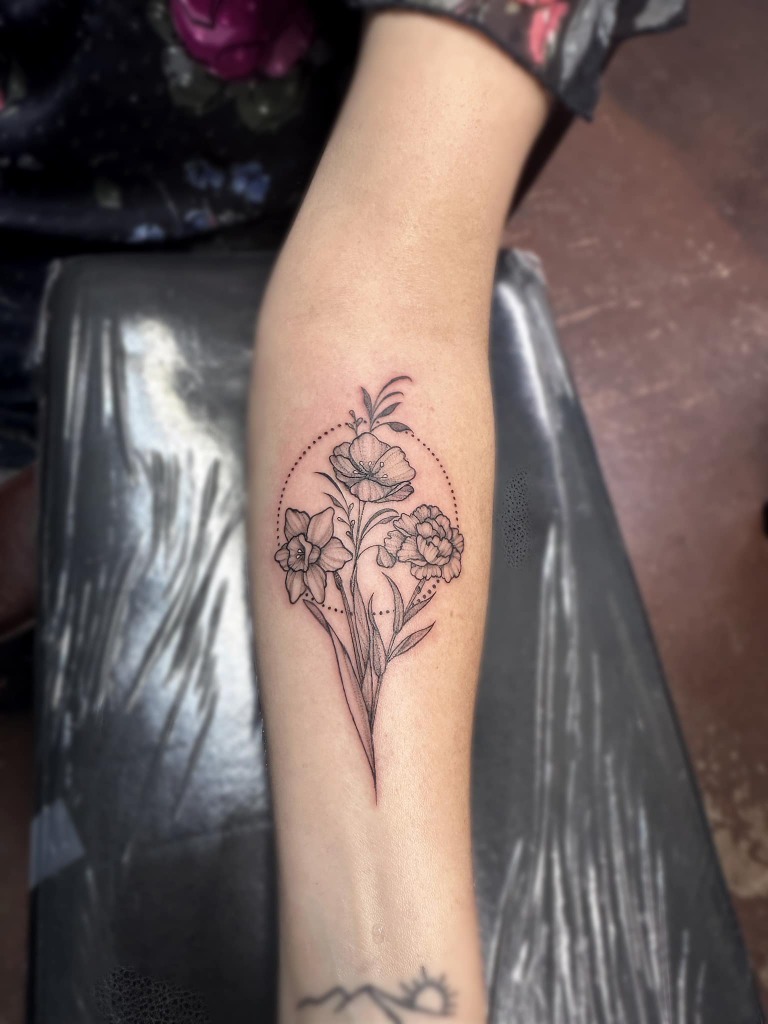 Fine line floral bouquet tattoo